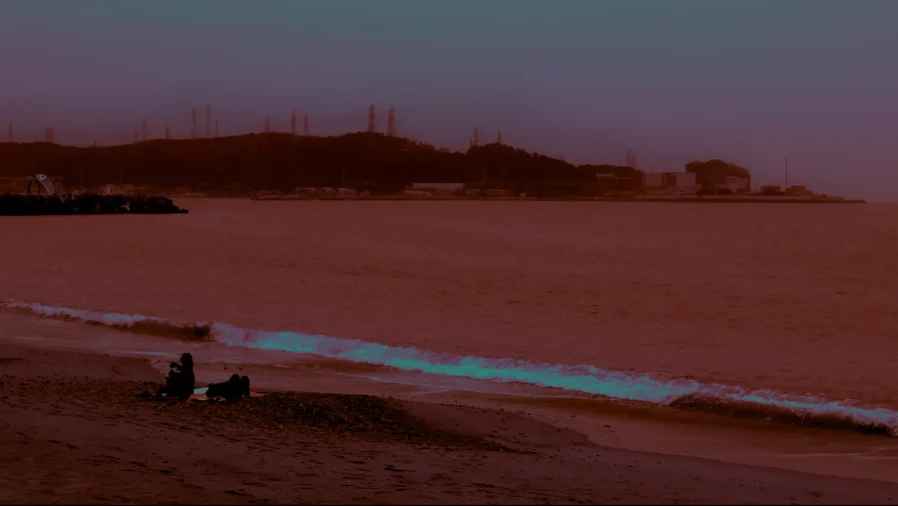 a beach in the night in a very red dimmed light